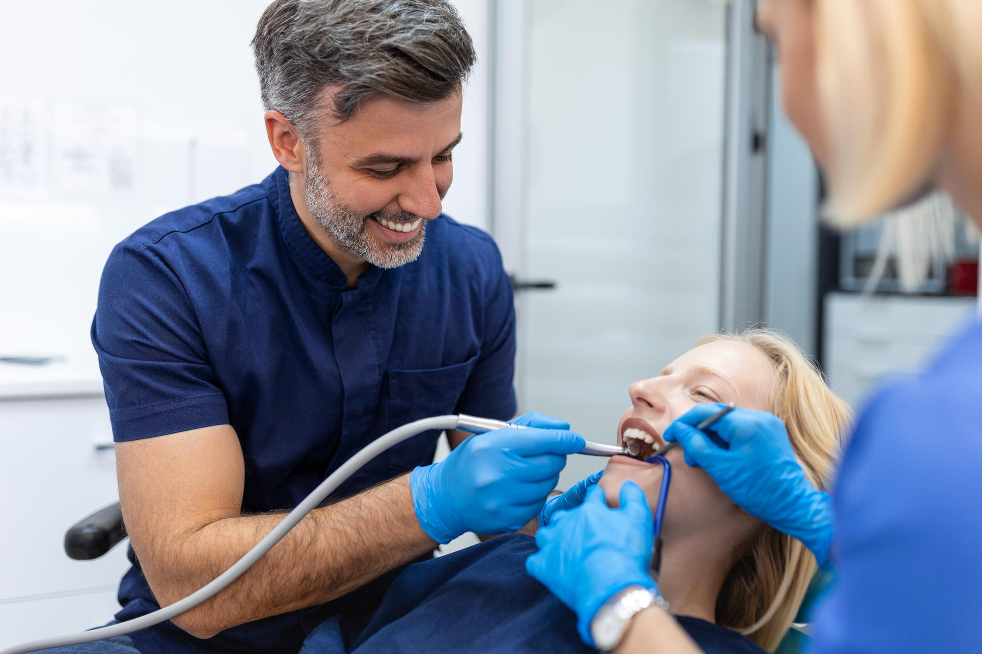Clinician talking with a patient in the treatment room